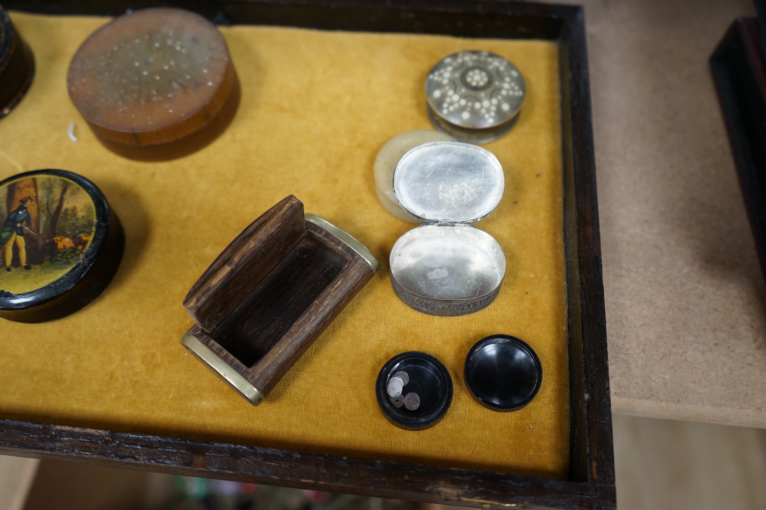 Ten various snuff boxes to include horn, white metal, brass mounted and one printed with a classical scene, 19th/20th century, largest 9cm in diameter. Condition - fair